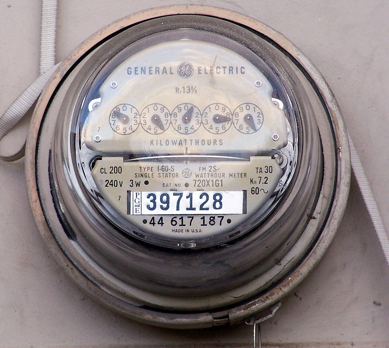 Electric meter on the side of a house